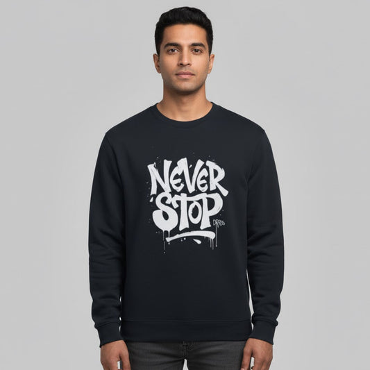 Man wearing a black sweatshirt with 'Never Stop' text on a gray background